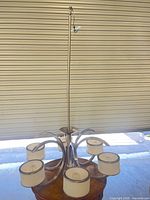 Full view of chandelier with six shades and downrod