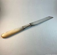 Full view of sterling silver and mother of pearl knife