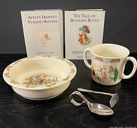 Group shot of bowl, mug, utensils, and both books