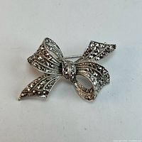 Front view showing full bow design and marcasite arrangement