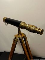 Telescope mounted on tripod, side view