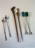 Group shot of all six cocktail picks showing size and design variety