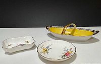 Group shot of three china dishes showing sizes and forms