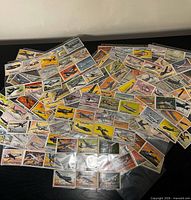 Assortment of Topps Wings cards spread out, showing artwork fronts