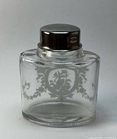 Clear etched glass vanity bottle front view