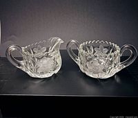 Creamer and sugar bowl side by side showing design