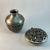 Vase and dish with lid displayed together