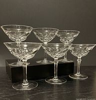 Front view of six crystal coupes showing stem and bowl design