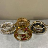 Group shot of all four teacup and saucer sets