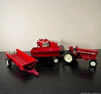 All four 1/16 scale die-cast farm toys arranged together
