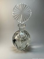 Full view of crystal perfume bottle with stopper assembled