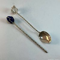 Pick and spoon showing twisted handles and stone finials