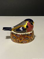 Left front view of Royal Crown Derby Bullfinch Nesting paperweight