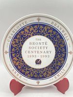 Front view of commemorative plate showing full design and text
