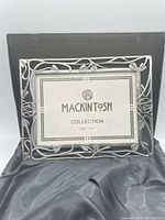 Front view of Mackintosh metal picture frame with insert