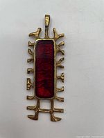 Full view of pendant front showing overall design and bail