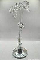 Full view of vase front showing glass flower top and silver-plated base