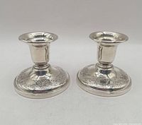 Pair of Birks sterling silver candlesticks front view