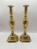 Full view of both brass candlesticks