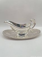 Gravy boat on underplate, side profile