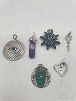 Group shot of all six sterling pendants