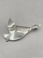 Front view of sterling Canada goose brooch