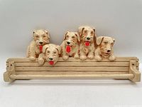 Front view showing full rack with five Scotty dogs and bar