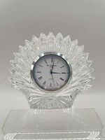 Front view of Waterford crystal desk clock showing full sunburst design and dial