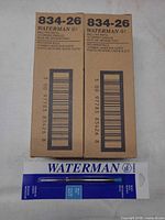 Two Waterman 834-26 factory boxes and one carded refill displayed front