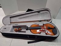 Violin inside hard case with bow