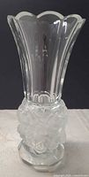 Full view of vase showing clear upper section and frosted rose base