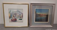 Both framed prints side by side
