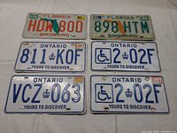 Front view of all six license plates