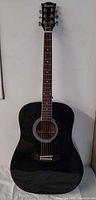 Full front view of black Maestro dreadnought acoustic guitar