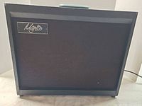 Front view showing Marlin logo, cloth grille and cabinet condition
