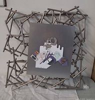 Full view of metal frame wall sculpture