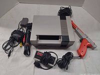 Console with controller, Zapper, AC adapter, AV cable, RF switch