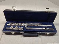 Flute disassembled in blue-lined hard case