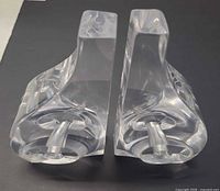Pair of clear acrylic bookends front angled view
