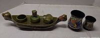 Boat-shaped inkstand with two small vases