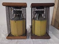 Front view of both Electrohome 75-11 System speakers showing wood caps, metal mesh grilles and internal yellow cones