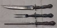 Full view of knife, fork, and steel lined up