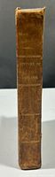 Spine view showing leather cover, raised bands, gilt title