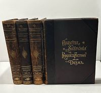 Spines and front board showing gilt titles, four volumes aligned