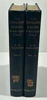 Spines of both volumes showing titles, author, volume numbers, publisher and library call-number labels