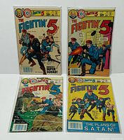 Front covers of all four Fightin' 5 comics bagged and boarded