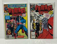 Front view of both bagged Damage Control #1 issues