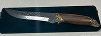 Full left side view of Kizlyar Snake knife on green case