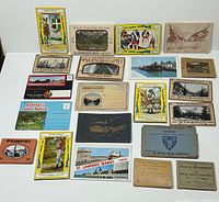 All 20 postcard sets laid out front covers visible