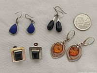 Front view of all four pairs of sterling silver gemstone earrings